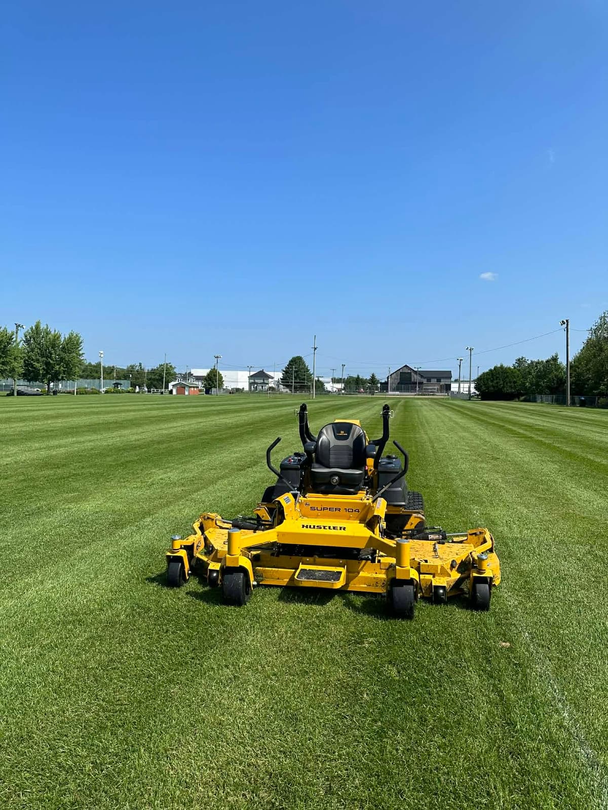 Zero-turn mower on a large lawn