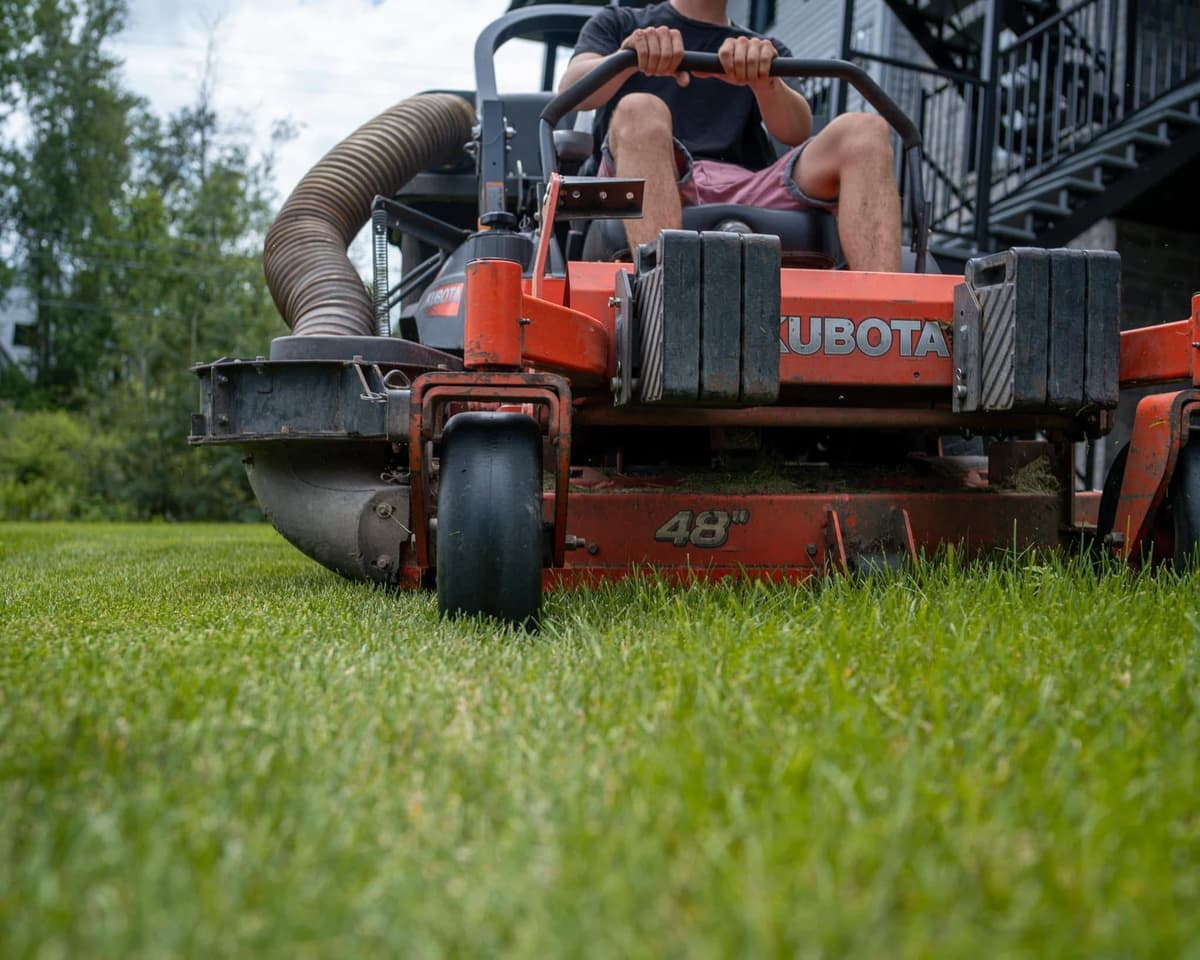Kubota ride-on mower on a freshly cut lawn